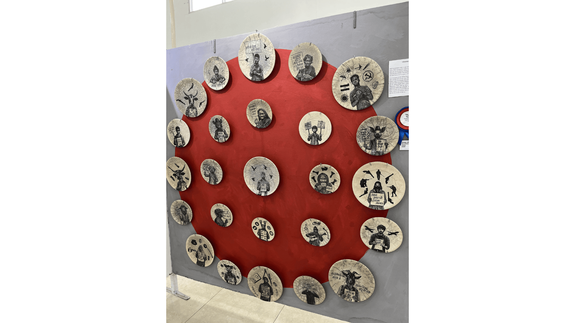 A ceramic plate art portraying social issues and dissent.